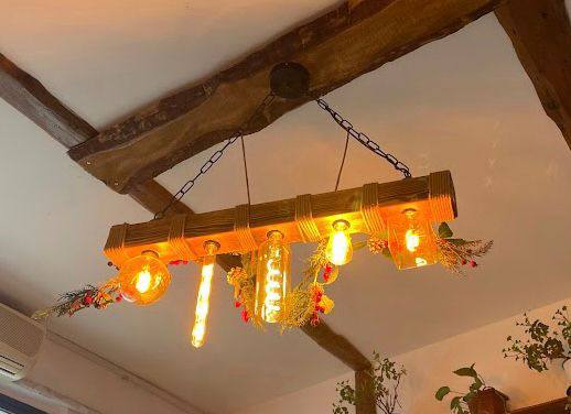Ceiling chandelier made of natural wood