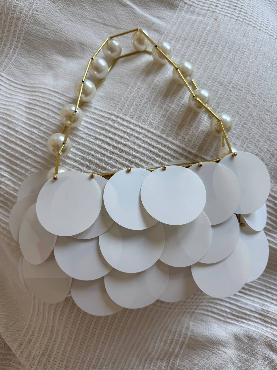White purse with pearl beads
