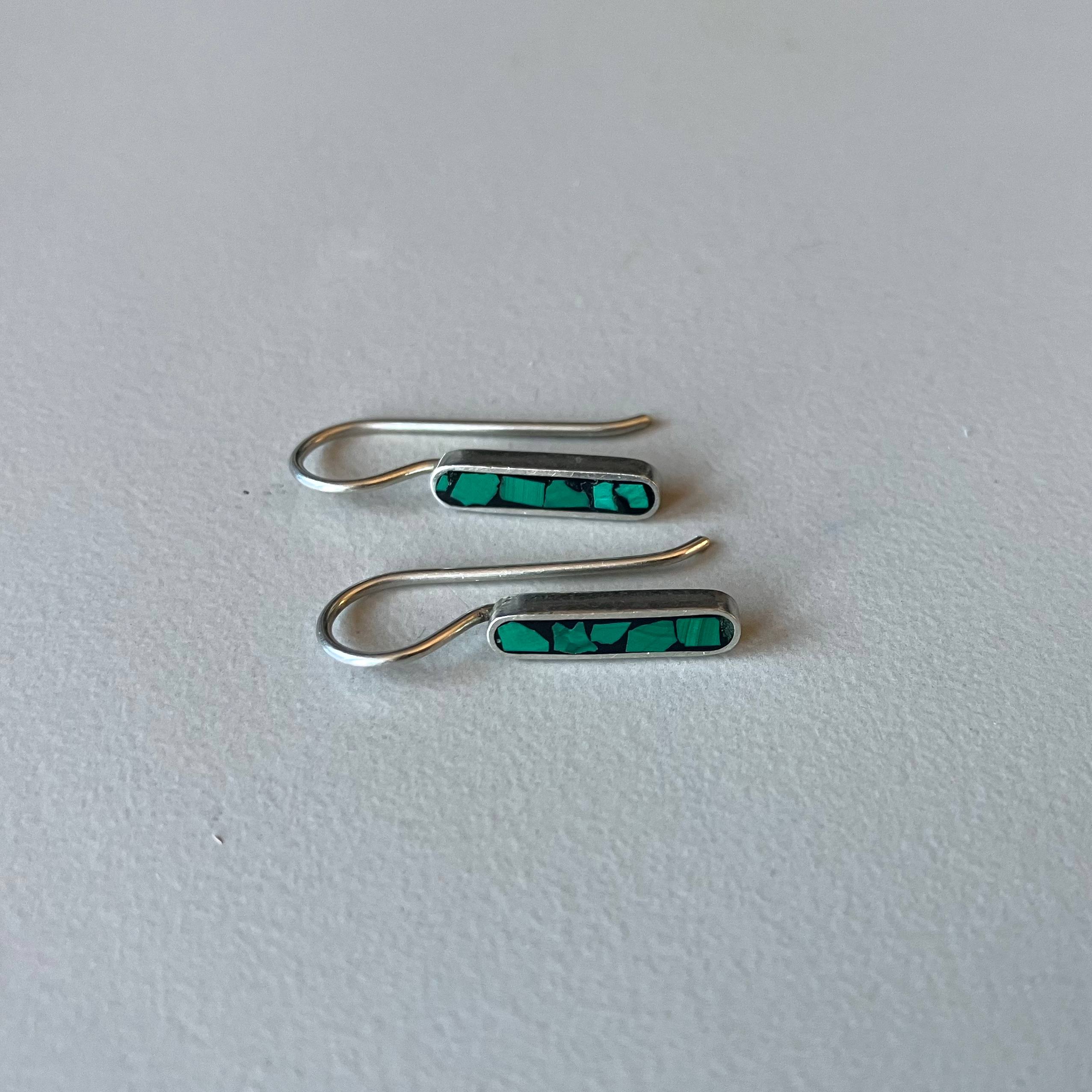 One silver oval earring